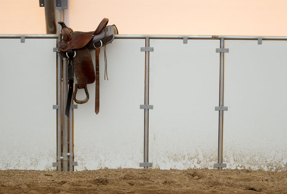 A saddle sits on a fence on Friday, April 29, 2011, at the Riata Ranch near Cheyenne.