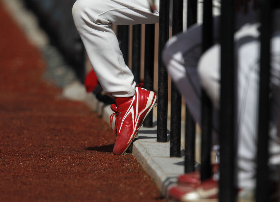 A Gillette player sticks his foot out of the dugout during a baseball game on Saturday, May 7, 2011, at Powers Field in Cheyenne.