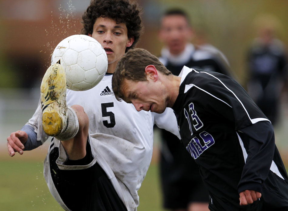 Cheyenne East's Jalen Willett (5) plays the ball away from Gillette's Cody Nice during a boy's soccer regional game on Thursday, May 12, 2011, at Cheyenne South High School. East won 4-2.