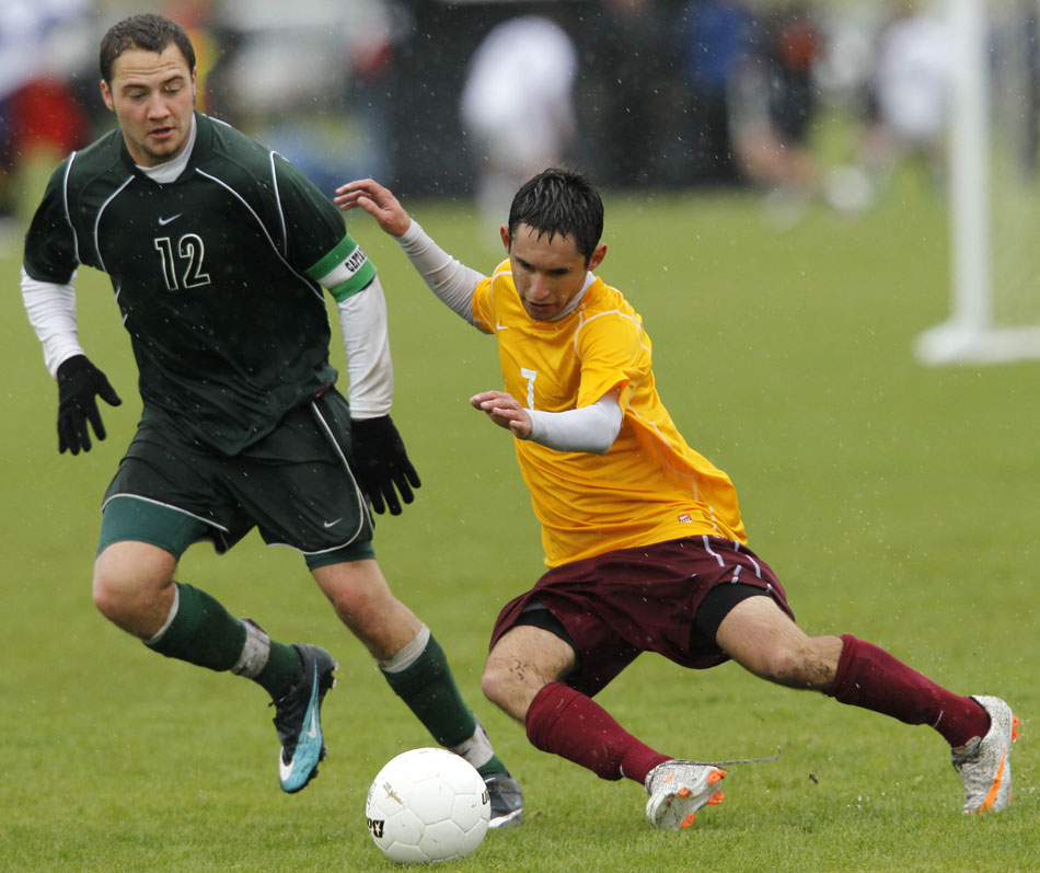Laramie's Vitor Nazareth (7) falls to the pitch after making contact with Kelly Walsh's Tanner Vivian during a Class 4A boy's state soccer semifinal on Friday, May 20, 2011, in Sheridan, Wyo.