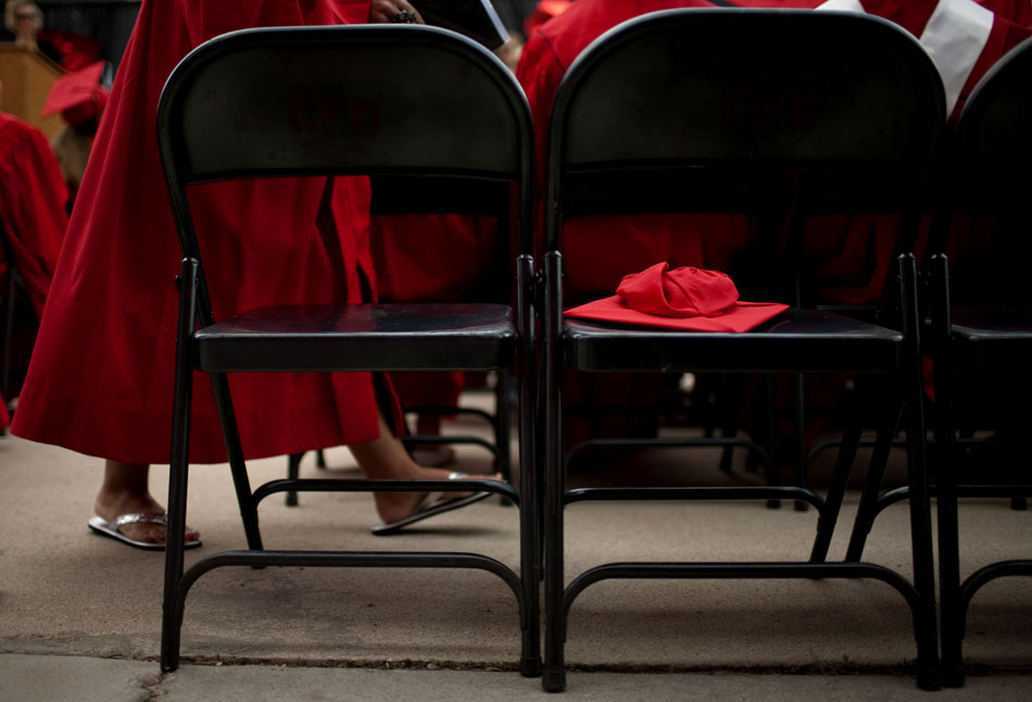 A graduate walks back to her seat with her diploma in flip flops during the Cheyenne Central High School graduation on Friday, May 27, 2011, at Frontier Park.
