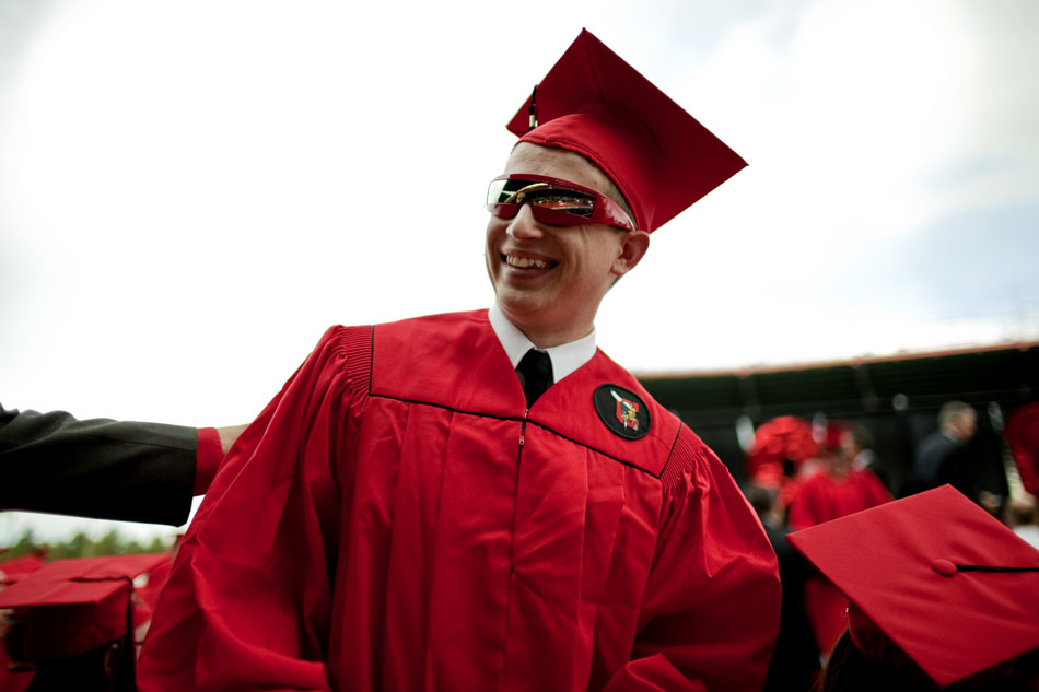 Bradly Schneider shares a smile with a faculty member after receiving his diploma during Cheyenne Central's graduation on Friday, May 27, 2011, at Frontier Park.
