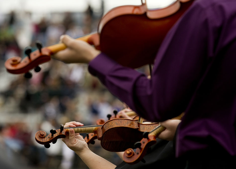 Members of the East High Strolling Strings perform during Cheyenne's East High School graduation on Saturday, May 28, 2011, at Okie Blanchard Stadium.