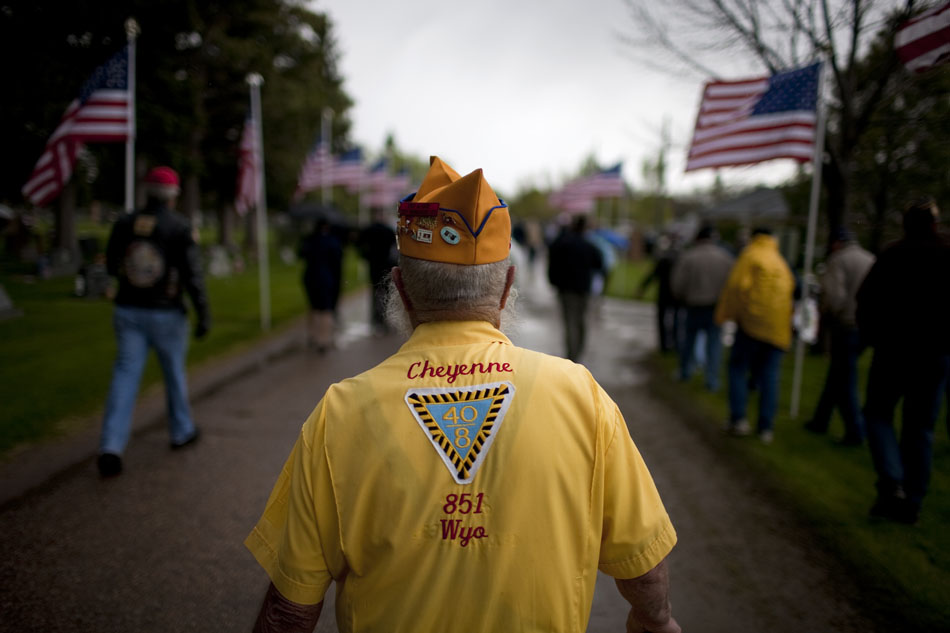 Clarence Porter, a member of the Forty and Eight Club, walks down a cemetery road after a Memorial Day ceremony on Monday, May 30, 2011, at Beth El Cemetery in Cheyenne.