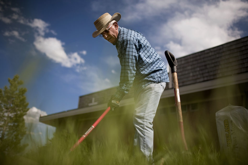 Ed Boenisch rakes some grass out of a soon-to-be community garden on Thursday, June 2, 2011, behind the Highlands United Presbyterian Church in Cheyenne. Garden organizers hope to donate produce raised on the garden to area shelters.