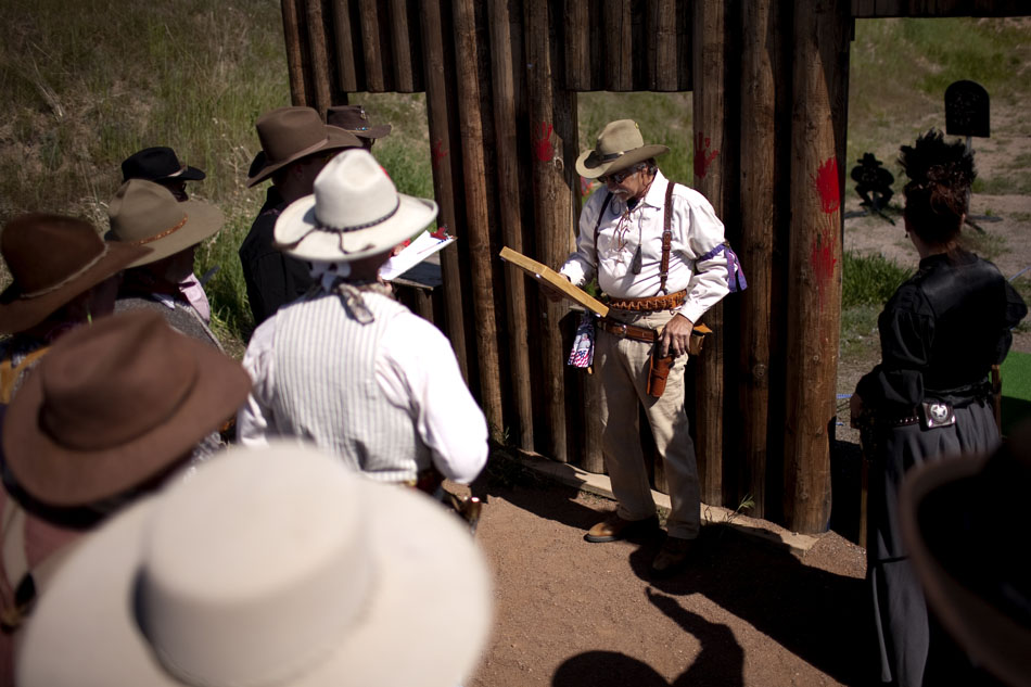 A Cheyenne Regulators "posse" meets to discuss the shooting protocol before a cowboy shoot on Saturday, June 4, 2011, at the group's firing range west of Cheyenne.