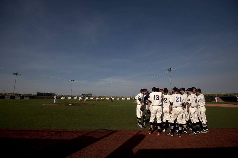 Cheyenne Post 6 players huddle up during a Denver Hit Streak pitching change during a high school baseball game on Saturday, June 4, 2011, at Powers Field in Cheyenne.