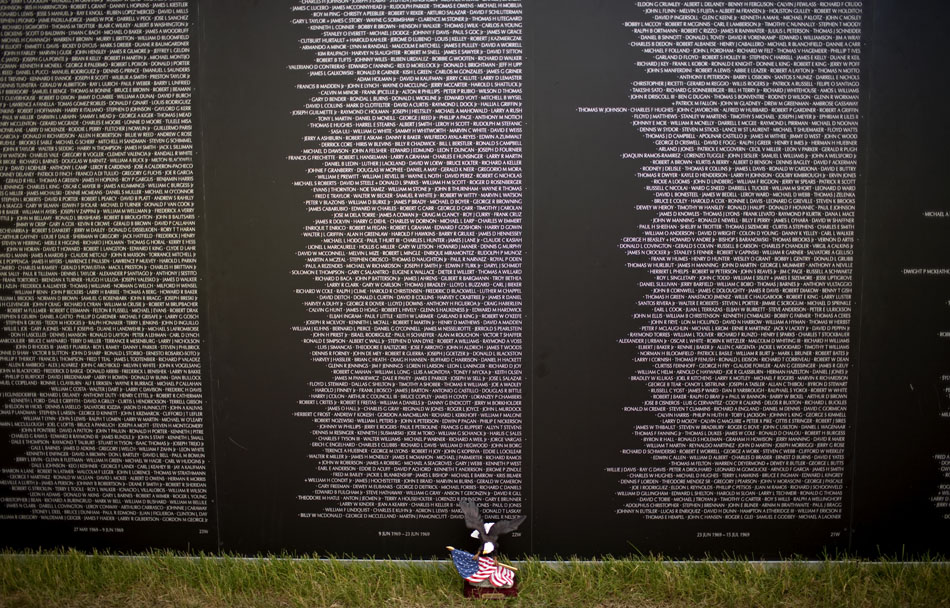A small memento sits at the base of a replica Vietnam Wall on Thursday, June 23, 2011, in Lions Park.