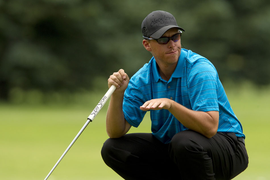 Jeff Keffer signals to another golfer as he lines up a putt on No. 7, a 202-yard par 3, during the second round of the 55th Tyrrell-Doyle Wyoming Open on Saturday, July 9, 2011, at the Airport Golf Course in Cheyenne, Wyo.