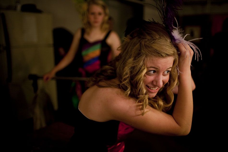 Maria Dobelmann, who plays a can can girl, smiles as she tries to get a feather to stay put in her hair before the opening night of the 55th Old Fashioned Melodrama on Thursday, July 14, 2011, at the Atlas Theatre in Cheyenne. The melodrama continues through Aug. 7.