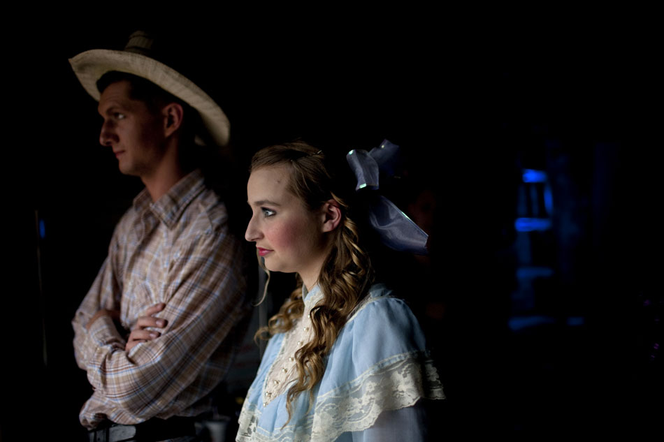 Mandy Hill, who plays the part of the heroine Lacie Camisole, and James Wagner, who plays Duncan Disorderly, look out a backdoor as a heavy rain falls before the opening night of the 55th Old Fashioned Melodrama on Thursday, July 14, 2011, at the Atlas Theatre in Cheyenne. The melodrama continues through Aug. 7.
