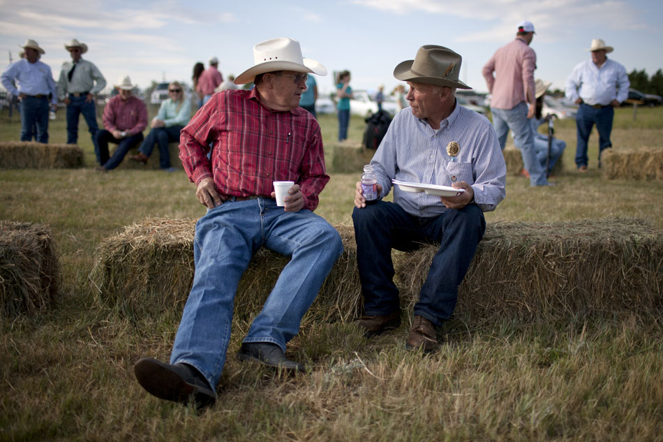 Patrons talk during a chuckwagon breakfast on Sunday, July 17, 2011,  at a pasture north of Cheyenne. After the breakfast, cowboys drove some 550 head of cattle about four miles south to Frontier Park in anticipation of the start of this year's Cheyenne Frontier Days.