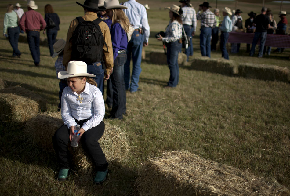 A youngster waits for the end of the chuckwagon breakfast on Sunday, July 17, 2011, north of Cheyenne.