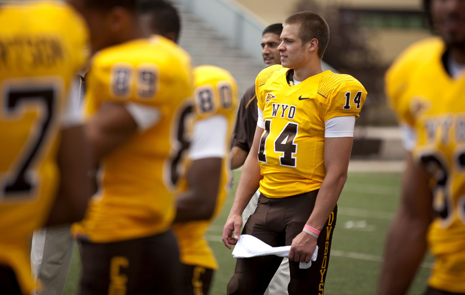 Wyoming quarterback Adam Pittser waits for one of several group and individual team photos during the University of Wyoming's media day on Saturday, Aug. 6, 2011, at Memorial Stadium in Laramie.