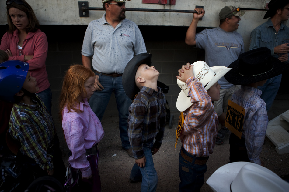 Youngsters wait in line as they make their way into the chutes for the mutton bustin at the Laramie County Fair on Wednesday, Aug. 10, 2011, at Frontier Park.