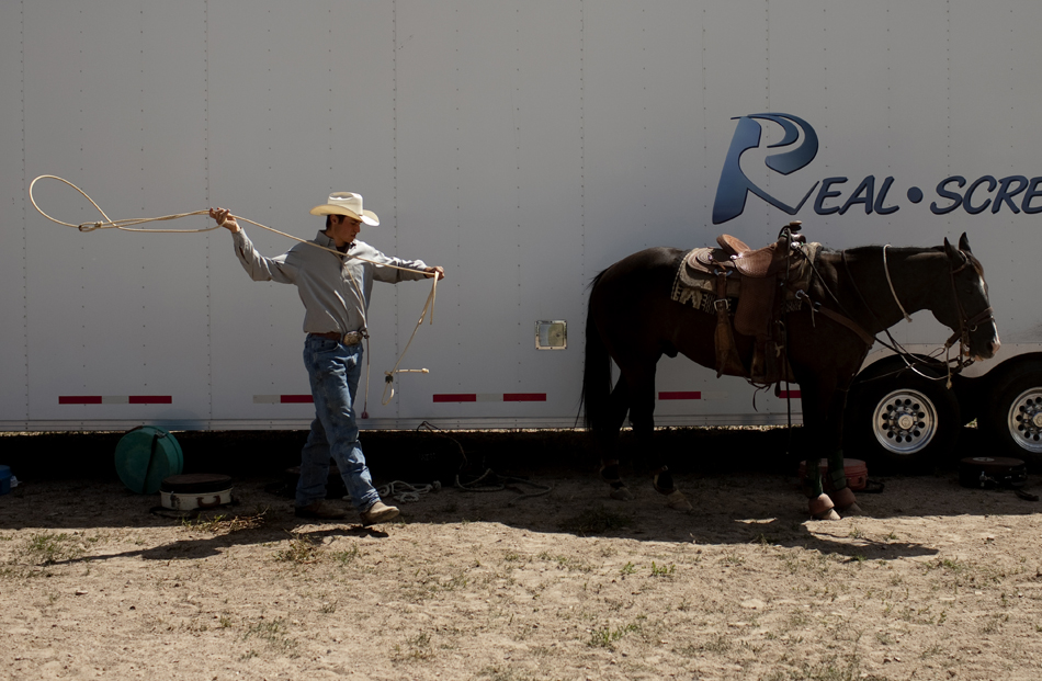 A participant warms up with a few practice throws of his lasso during the first go of slack tie-down roping on Wednesday, July 20, 2011, at Frontier Park.