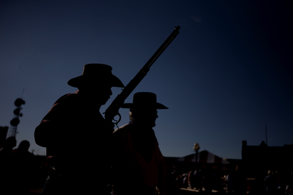 Members of the Cheyenne Gunslingers stand near the entrance of the Depot Plaza to promote their show during the Cheyenne Frontier Days Pancake Breakfast on Monday, July 25, 2011, in downtown Cheyenne.