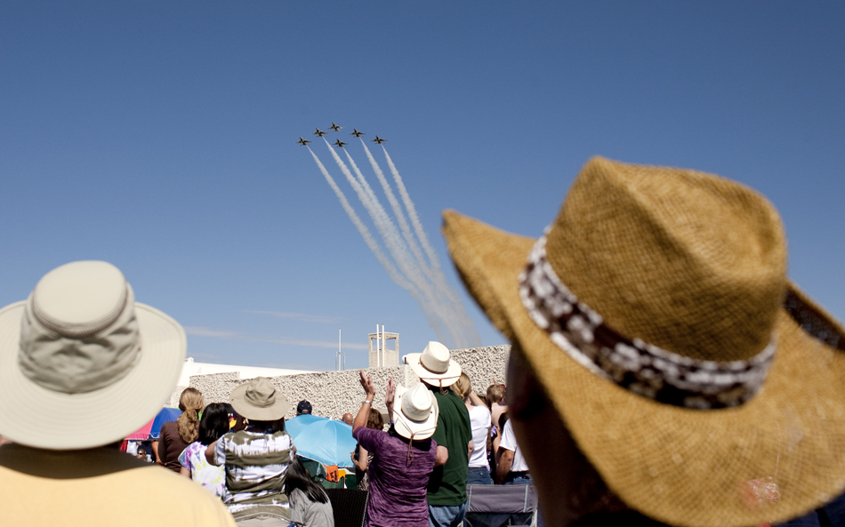 Spectators watch as the U.S. Air Force Thunderbirds fly over Laramie County Community College as they make their entrance for a performance on Wednesday, July 27, 2011.