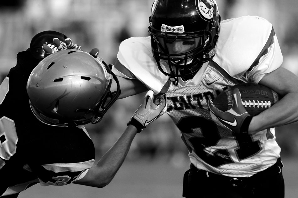 Cheyenne Central's Greg Ashley, right, stiff arms Cheyenne South's Andy Moyte on a rush during a Class 4A football game on Friday, Sept. 2, 2011, at Cheyenne South High School. Central won 63-0.