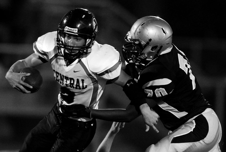 Cheyenne South's James Marshall, right, sacks Cheyenne Central quarterback Kyler Robinson during a Class 4A football game on Friday, Sept. 2, 2011, at Cheyenne South High School. Marshall forced a fumble on the play that South recovered.