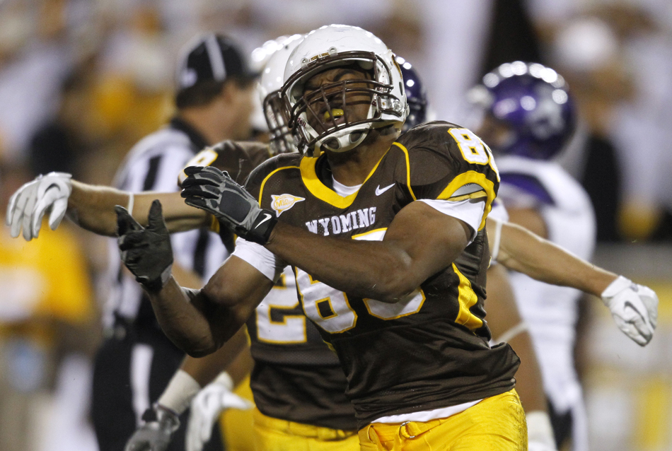 Wyoming defensive end Mark Willis celebrates after a tackle for a loss during a NCAA college football game on Saturday, Sept. 3, 2011, at War Memorial Stadium in Laramie, Wyo.