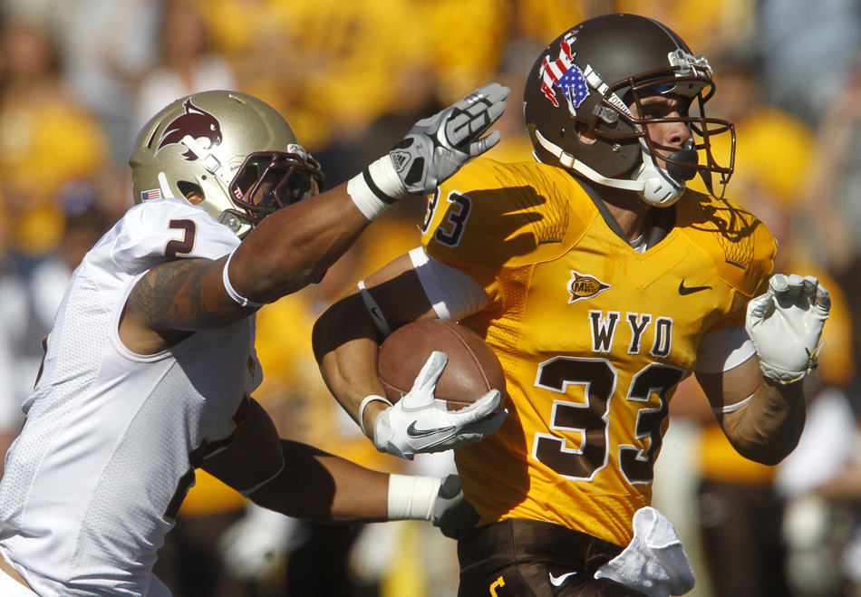 Texas State cornerback Darryl Morris (2) chases down Wyoming wide receiver Dominic Rufran after a long reception during a NCAA college football game on Saturday, Sept. 10, 2011, at War Memorial Stadium in Laramie, Wyo.