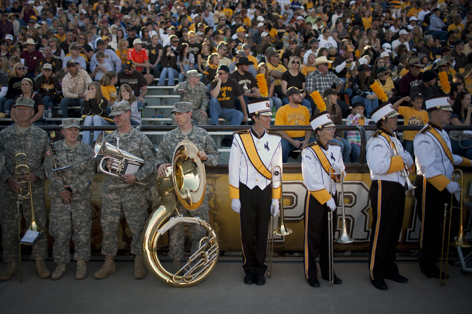 Band members wait for the end of the first half during a NCAA college football game on Saturday, Sept. 10, 2011, at War Memorial Stadium in Laramie, Wyo.