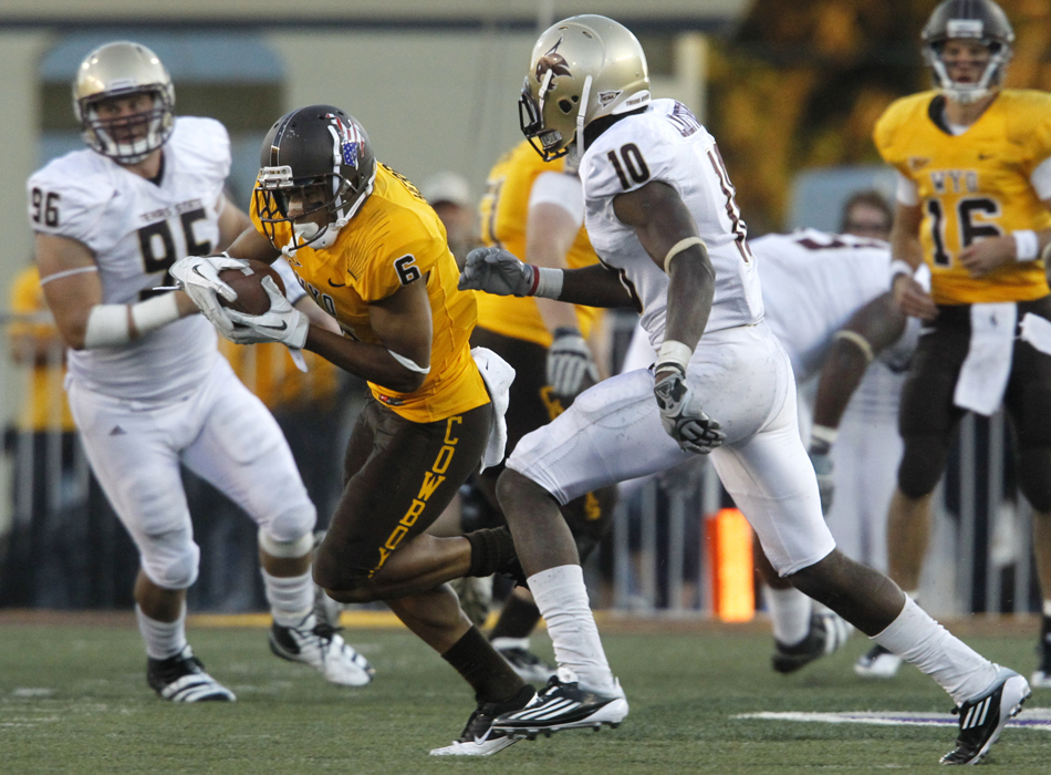 Wyoming wide receiver Robert Herron (6) runs through the Texas State secondary after catching the ball on a slant route during a NCAA college football game on Saturday, Sept. 10, 2011, at War Memorial Stadium in Laramie, Wyo.