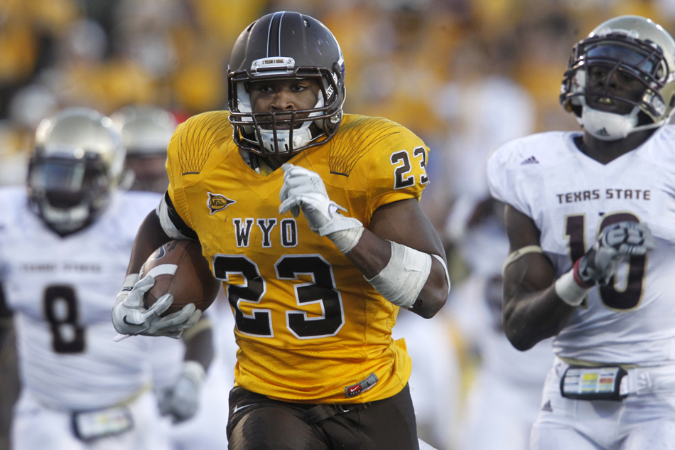 Wyoming running back Ghaali Muhammad (23) breaks off a long run for a touchdown during a NCAA college football game on Saturday, Sept. 10, 2011, at War Memorial Stadium in Laramie, Wyo.
