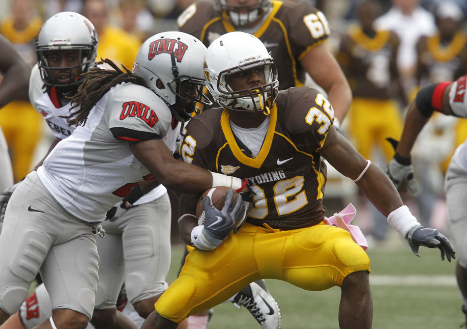 Wyoming running back Alvester Alexander navigates his way through the UNLV defense during a NCAA college football game on Saturday, Oct. 15, 2011, in Laramie, Wyo.