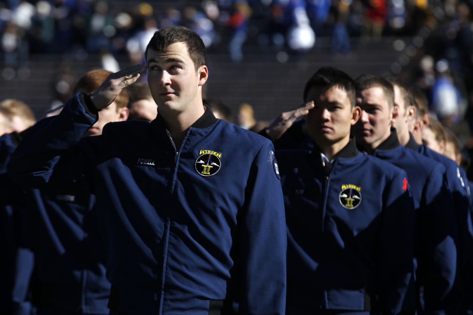 Cadets salute before the start of an Air Force game against Wyoming on Saturday, Nov. 12, 2011, at Falcon Stadium in Colorado Springs, Colo.