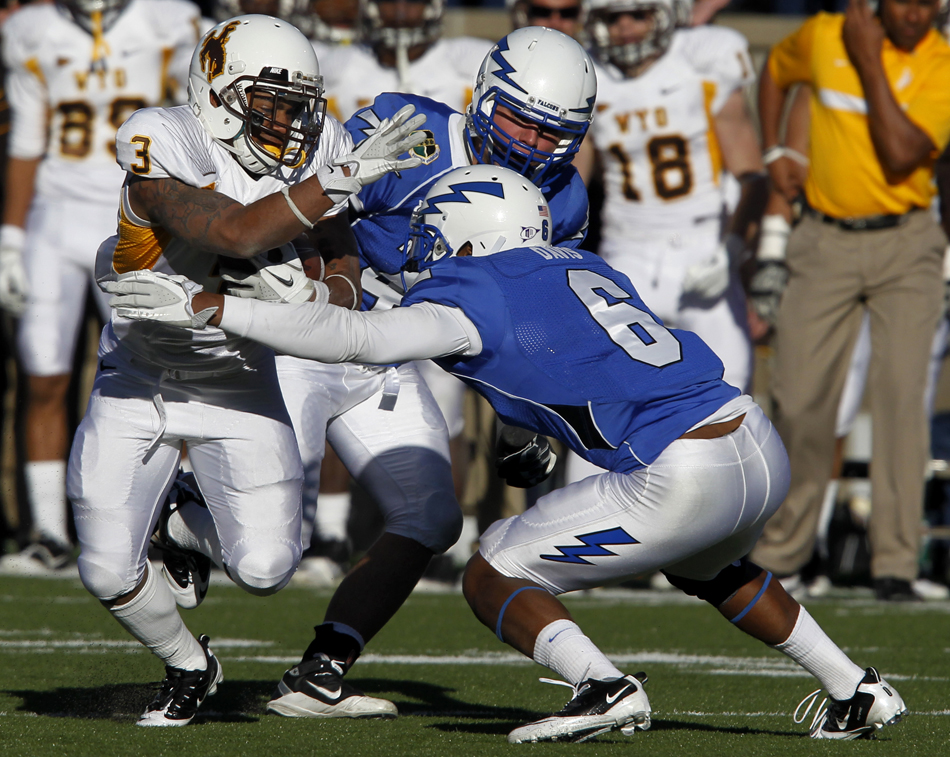 Wyoming running back Kody Sutton (3) looks to make a move in front of Air Force defensive back Jon Davis (6) during a NCAA college football game on Saturday, Nov. 12, 2011, at Falcon Stadium in Colorado Springs, Colo.