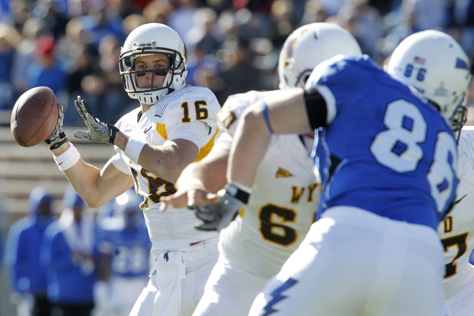 Wyoming quarterback Brett Smith (16) looks to pass during a NCAA college football game on Saturday, Nov. 12, 2011, at Falcon Stadium in Colorado Springs, Colo.