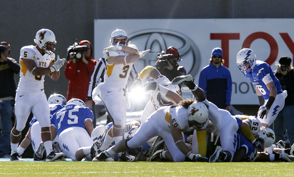 Wyoming safety Luke Anderson (3) signals after the Wyoming defense stopped Air Force on a fourth down during a NCAA college football game on Saturday, Nov. 12, 2011, at Falcon Stadium in Colorado Springs, Colo.