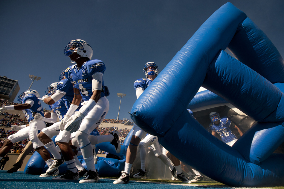 Air Force players including Anthony Wooding (4) run onto the field before the start of a NCAA college football game against Wyoming on Saturday, Nov. 12, 2011, at Falcon Stadium in Colorado Springs, Colo. James Brosher/staff
