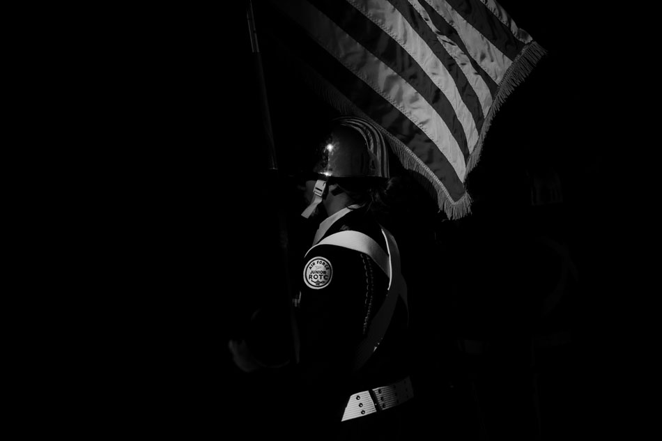 A member of the Cheyenne East Air Force ROTC carries the American Flag before a ceremony unveiling a sculpture of former Gov. Stanley Hathaway on Friday, Nov. 18, 2011, at the Hathaway Building in downtown Cheyenne.