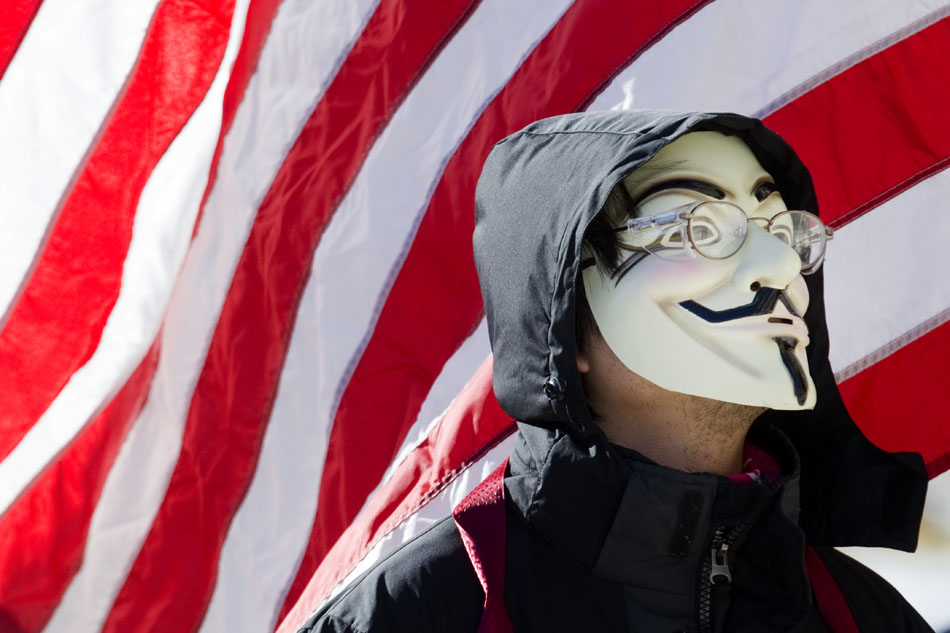 A protestor sports a Guy Fawkes mask during Occupy Cheyenne on Saturday, Dec. 10, 2011, at the Wyoming State Capitol in Cheyenne.