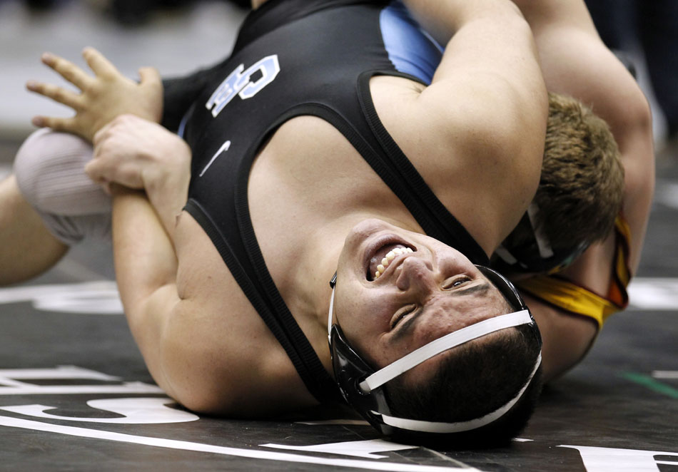 Cheyenne East's Michael Galicia reacts as he's twisted by Star Valley's Dawson Loveland during a semi-final match in the 4A 215 pound weight class on Friday, Feb. 25, 2011, in Casper, Wyo. Loveland won the match. (James Brosher/Wyoming Tribune Eagle)