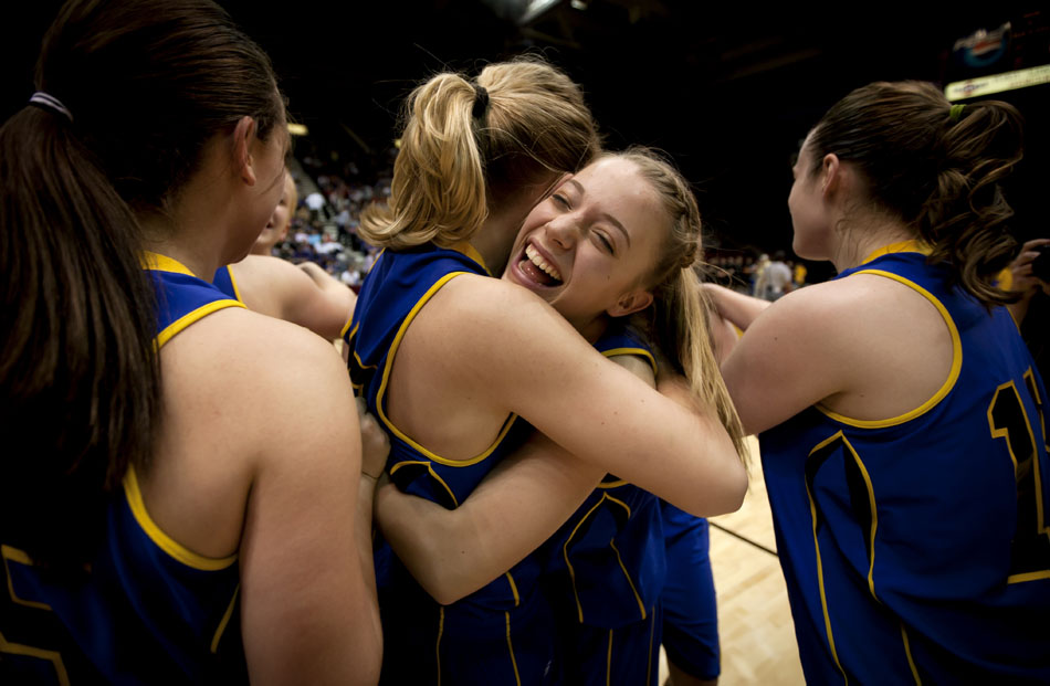 Wheatland's Muira Bunker, center, celebrates with her teammates after a 47-41 win against Buffalo in the Class 3A girl's basketball state championship game on Saturday, March 12, 2011, in Casper, Wyo. (James Brosher/Wyoming Tribune Eagle)