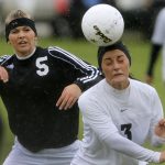 Laramie's Lindsey Martinez (3) heads the ball away from Cheyenne East's Chelsea Crampton-Weber during a Class 4A girl's state soccer semifinal on Friday, May 20, 2011, in Sheridan, Wyo. (James Brosher/Wyoming Tribune Eagle)