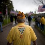 Clarence Porter, a member of the Forty and Eight Club, walks down a cemetery road after a Memorial Day ceremony on Monday, May 30, 2011, at Beth El Cemetery in Cheyenne. (James Brosher/Wyoming Tribune Eagle)