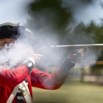 David Morgan from Arvada, Colo., fires an American-revolution era Brown Bess musket during a demonstration for visitors during the first day of Fort D.A. Russell Days on Friday, July 22, 2011, at F.E. Warren Air Force Base in Cheyenne. (James Brosher/Wyoming Tribune Eagle)