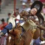 Tyler Scales from Severence, Colo. rides a horse named Phillip Scott bareback during the Cheyenne Frontier Days rodeo on Tuesday, July 26, 2011, at Frontier Park. Scales registered no time on the ride. (James Brosher/Wyoming Tribune Eagle)
