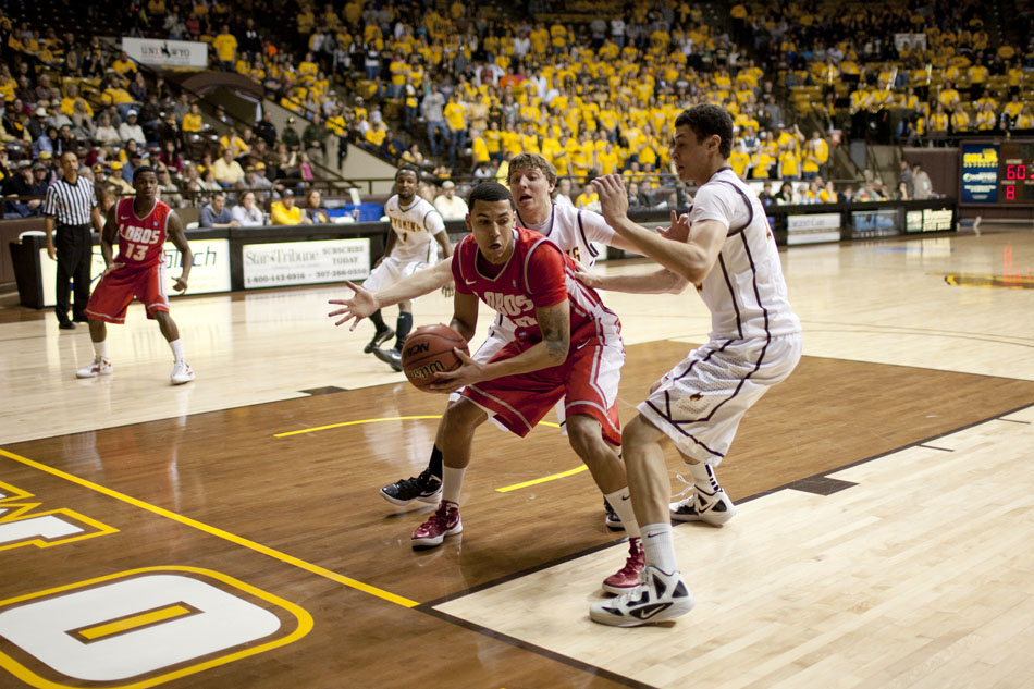 Wyoming players trap New Mexico guard Kendall Williams in the backcourt during a NCAA men's basketball game on Saturday, Jan. 14, 2012, at the Arena-Auditorium in Laramie, Wyo. Wyoming lost 72-62. (James Brosher/Wyoming Tribune Eagle)