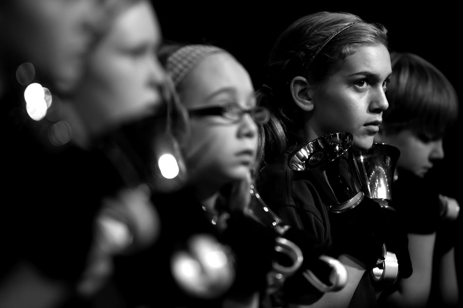 Bella Ravotto waits to play the bells with her fifth-grade Mishawaka Catholic School classmates during the All Schools Mass on Monday, Feb. 27, 2012, in the Purcell Pavilion at the University of Notre Dame. (James Brosher/South Bend Tribune)