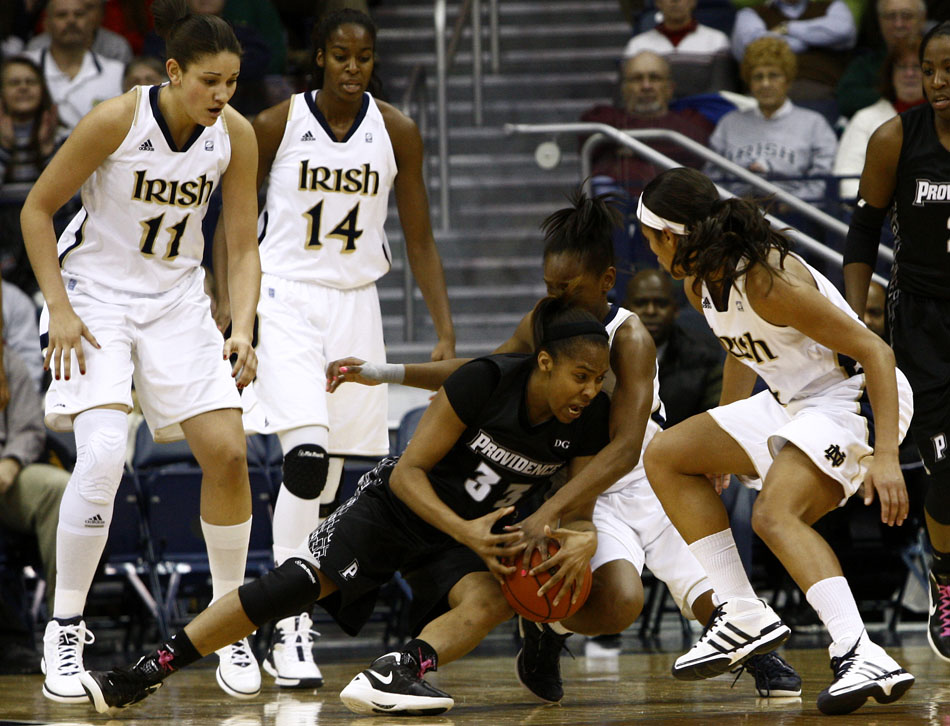 Providence forward Brianna Edwards falls to the floor as she tries to work through the Notre Dame defense during a women's NCAA college basketball game on Tuesday, Feb. 14, 2012, at Notre Dame. (James Brosher/South Bend Tribune)