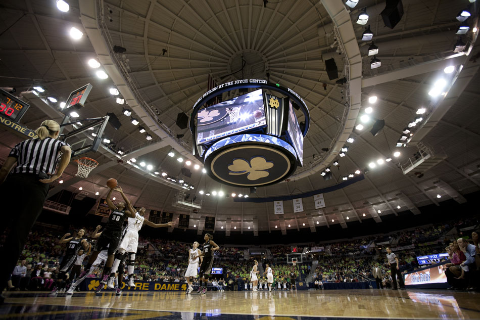 Providence guard/forward Rachel Barnes grabs a rebound in front of Notre Dame forward Devereaux Peters during a women's NCAA college basketball game on Tuesday, Feb. 14, 2012, at Notre Dame. (James Brosher/South Bend Tribune)