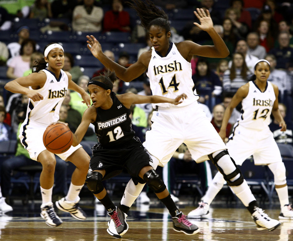 Notre Dame forward Devereaux Peters (14) guards Providence guard Symone Roberts during a women's NCAA college basketball game on Tuesday, Feb. 14, 2012, at Notre Dame. (James Brosher/South Bend Tribune)