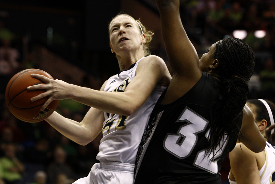 Notre Dame guard Natalie Novosel goes in for a shot as she's guarded by Providence forward Lauren Okafor during a women's NCAA college basketball game on Tuesday, Feb. 14, 2012, at Notre Dame. (James Brosher/South Bend Tribune)