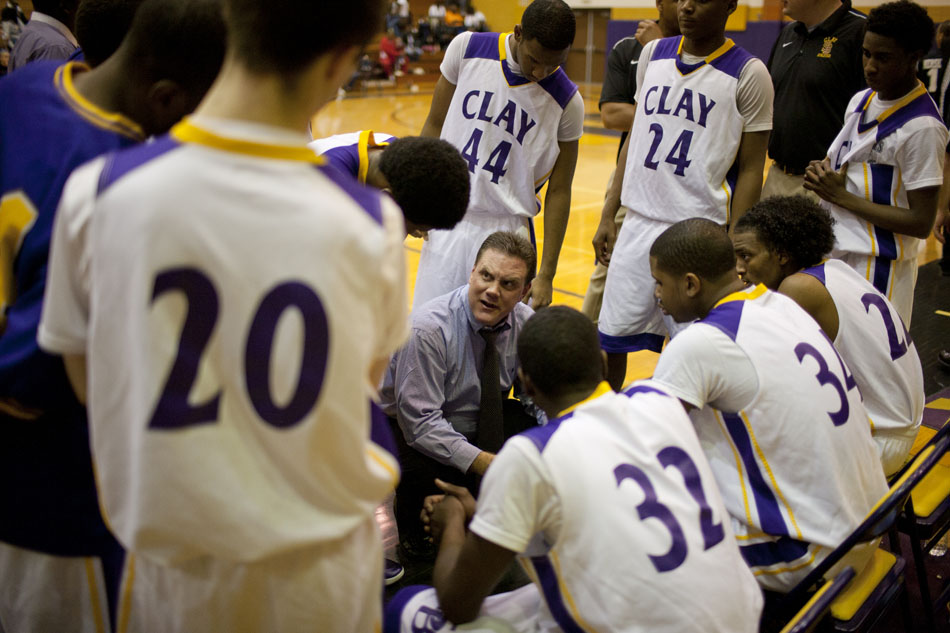 Clay coach Joe Huppenthal talks to his players before the start of the second half in a high school basketball game on Tuesday, Feb. 21, 2012, at Clay High School in South Bend. (James Brosher/South Bend Tribune)